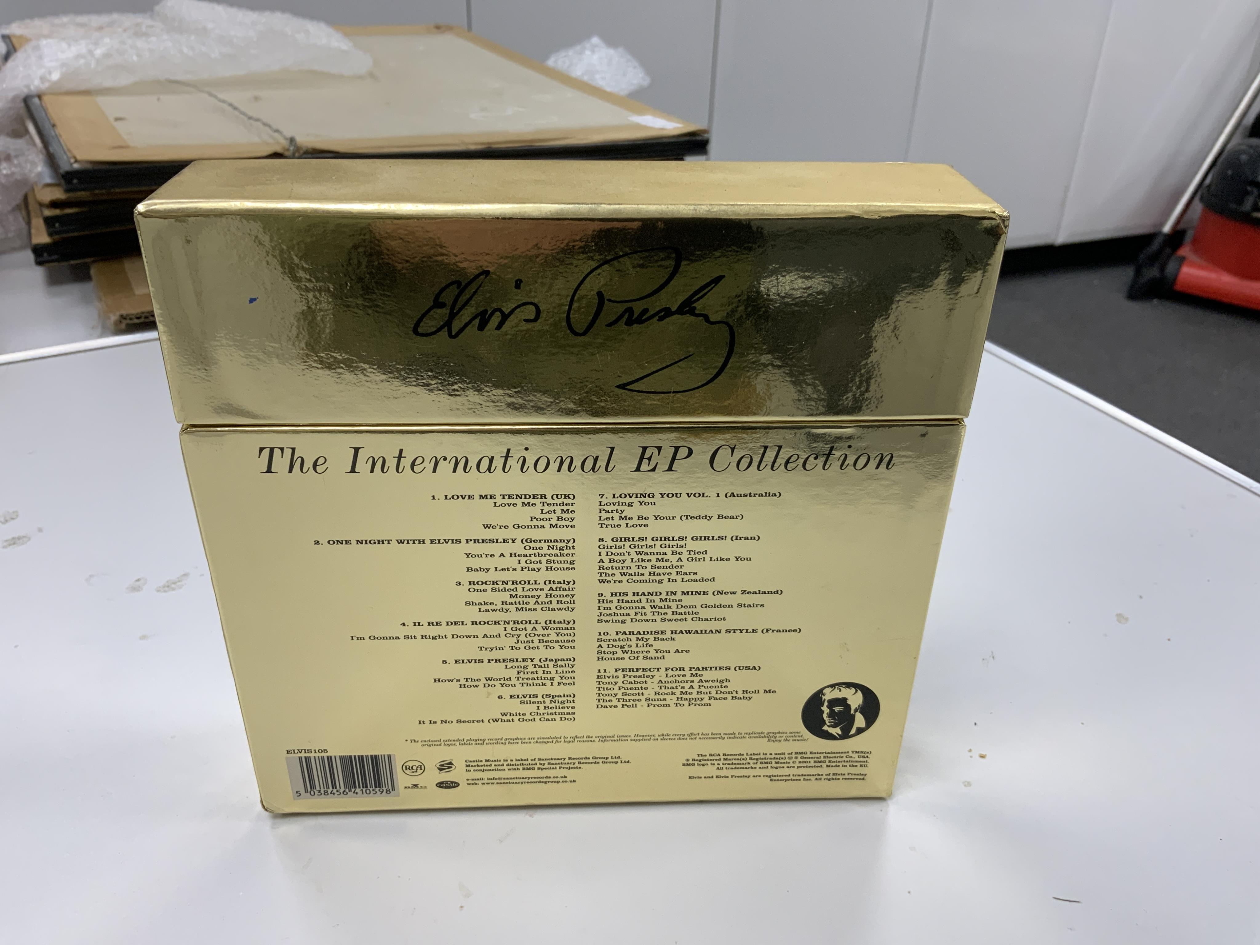 Elvis Presley, The International EP Collection box set, comprising of eleven 7 inch 45rpm record on RCA Victor labels and a poster. Condition - good